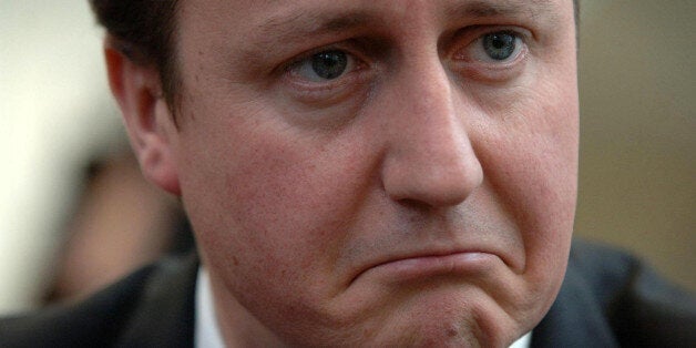 Leader of the Conservative party David Cameron listens to constituents of Reading East talking about the cost of living, in Cafe Giardino, in the Oracle shopping centre, Reading.