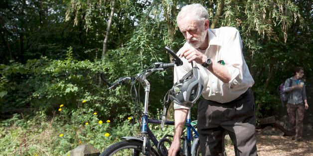 Labour leadership contender Jeremy Corbyn arrives by bicycle to launch his new policies on the environment at Camley Street Natural Park in London