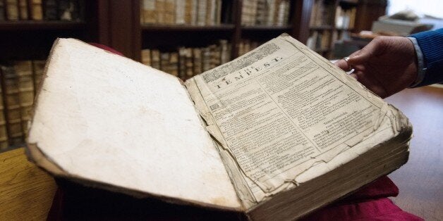 Remy Cordonnier, librarian in the northern town of Saint-Omer, near Calais carefully shows an example of a valuable Shakespeare 'First Folio', a collection of some of his plays, dating from 1623. Around 230 copies of the First Folio are known to exist in collections or in private hands around the world. The young librarian said he came across the book in September when he was selecting books for an forthcoming exhibition on historic links between the local region and England. AFP PHOTO/DENIS CHA