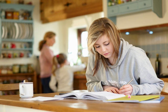 Young student doing homework.