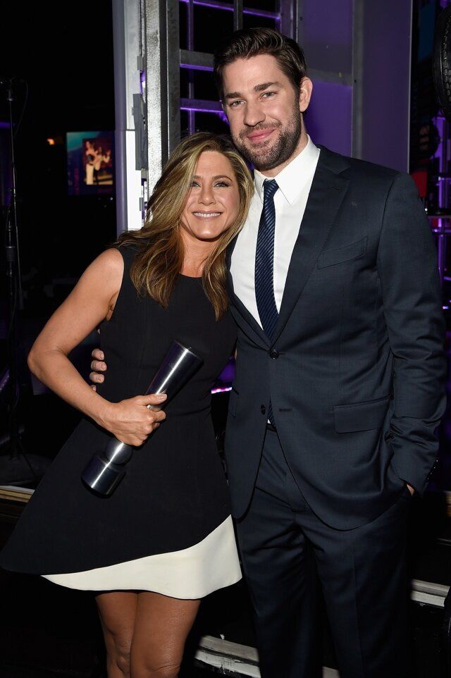 BEVERLY HILLS, CA - DECEMBER 18: Actress Jennifer Aniston (L), winner of the Movie Performance of the Year - Actress award, and actor John Krasinski attend the PEOPLE Magazine Awards at The Beverly Hilton Hotel on December 18, 2014 in Beverly Hills, California. (Photo by Kevin Mazur/PMA2014/WireImage)