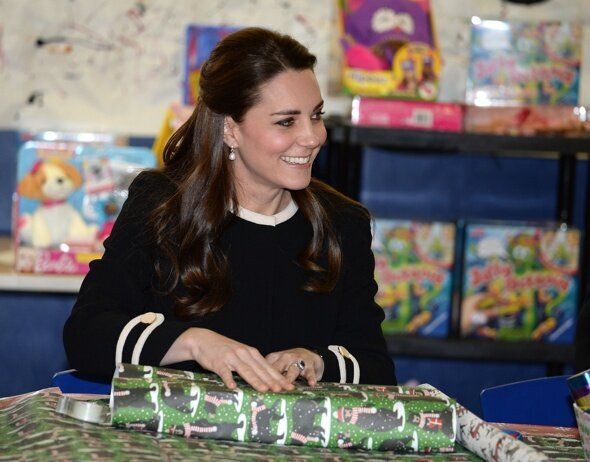 Mandatory Credit: Photo by REX (4283378ac) Catherine Duchess of Cambridge Prince William and Catherine Duchess of Cambridge visit to New York, America - 08 Dec 2014 The Duchess of Cambridge wraps presents and meets pupils at the Northside Center in Harlem
