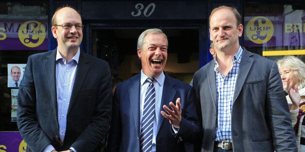 Ukip leader Nigel Farage (centre) and newly elected Ukip MP Douglas Carswell (right) joins their party's candidate Mark Reckless on Rochester High Street, Kent, as they join him on the campaign trail for the upcoming Rochester and Strood by-Election.