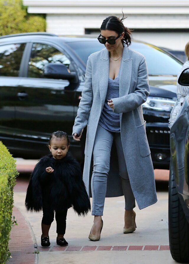 NO JUST JARED USAGE Kim Kardashian and her baby North, dressed in a black fur cape, arriving at a friend's house in Beverly Hills. ****NO DAILY MAIL SALES****  Pictured: Kim Kardashian and North West Ref: SPL900803 281114  Picture by: Splash News Splash News and Pictures Los Angeles: 310-821-2666 New York: 212-619-2666 London: 870-934-2666 photodesk@splashnews.com 
