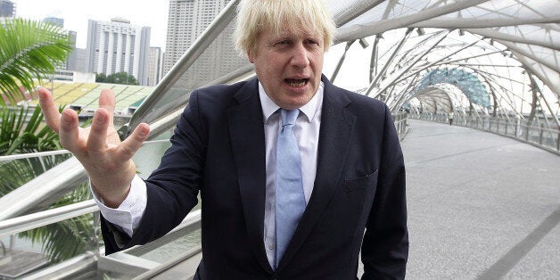 SINGAPORE - NOVEMBER 28: Mayor of London, Boris Johnson takes in the sight at the Helix Bridge at Marina Bay prior to speaking at the FinTech event at the ArtScience Museum on November 28, 2014 in Singapore. Mayor Boris Johnson is on a six day trade mission to the Far East to build on his work to create jobs and growth, and promote London as a major investment destination as he leads a trade mission to Singapore, Jakarta and Kuala Lumpur. (Photo by Suhaimi Abdullah/Getty Images)