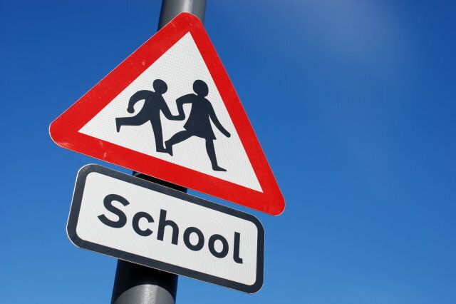 School children crossing sign with copy space