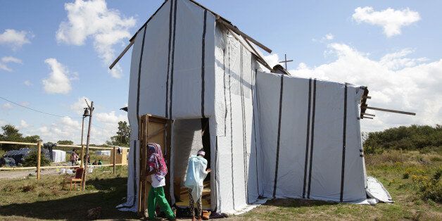 File photo dated 30/07/15 of worshippers attending an Ethiopian Orthodox church erected in the migrant camp known as the new Jungle in Calais, France. Filming BBC's Songs of Praise from the migrant camp has been defended by the channel's head of religion who said the programme is not just about music.