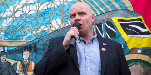 Steve Hedley, Senior Assistant General Secretary of the Rail, Maritime and Transport (RMT) union, makes a speech to members of the union protesting outside Paddington station in London, as train services on some of the country's busiest routes will be "significantly" hit because of a strike by rail workers.