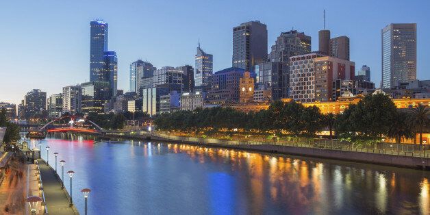 The lights of Melbourne City reflect in the Yarra river at night