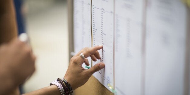 Students view the results of the baccalaureat exam (high school graduation exam) on July 7, 2015 at the Georges Brassens secondary school in Paris. AFP PHOTO / MARTIN BUREAU (Photo credit should read MARTIN BUREAU/AFP/Getty Images)