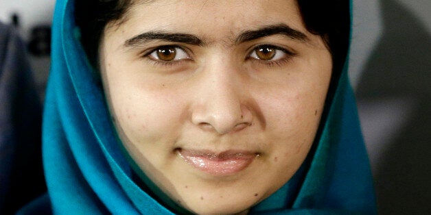 FILE - In this Oct. 10, 2013 file photo, Malala Yousafzai poses for photographs in New York. The U.N. agency that assists Palestinian refugees says Nobel Peace Prize laureate Malala Yousafzai has donated $50,000 to rebuild a U.N. school that was damaged during the recent war between Israel and Hamas militants. (AP Photo/Frank Franklin II, File)