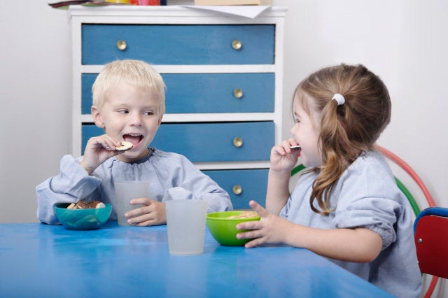 Children eating snacks in classroom