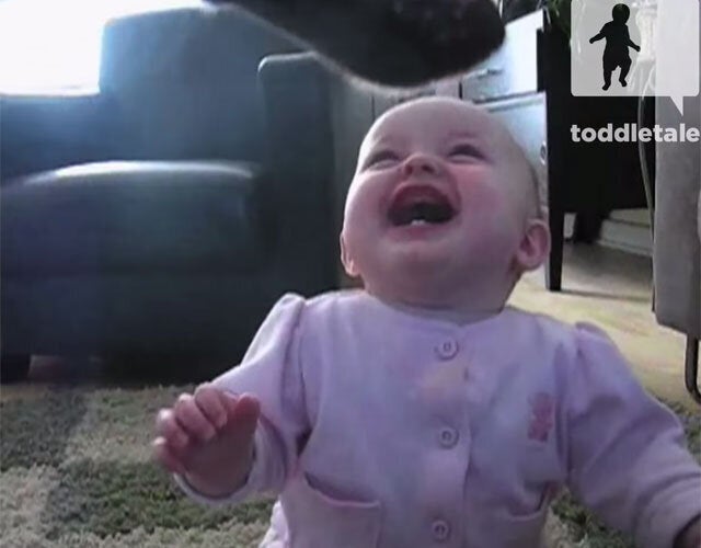 baby and dog eating popcorn