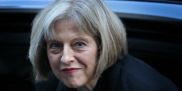 LONDON, ENGLAND - NOVEMBER 04: Home Secretary Theresa May arrives in Downing Street on November 4, 2014 in London, England. Liberal Democrat MP Norman Baker has resigned as a Home Office Minister saying that working in the Home Office was 'Like walking through mud'. (Photo by Peter Macdiarmid/Getty Images)