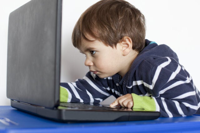 Small boy in front of a laptop