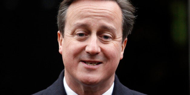 British Prime Minister David Cameron speaks to the media as he arrives for talks at Stormont House, Belfast, Northern Ireland, Thursday, Dec. 11, 2014. The Prime Minister and his Irish counterpart Enda Kenny are meeting in hopes of forging an agreement to sustain Northern Ireland's fraying unity government. (AP Photo/Peter Morrison)