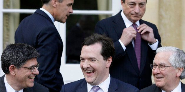 AYLESBURY, ENGLAND - MAY 10: (Front row L-R) Lew Jacob, U.S. Treasury Secretary, George Osborne Britain's Chancellor of the Exchequer, and Mervyn King, then Governor of the Bank of England, react, as they take part in the family photo with Mark Carney, then Governor of the Bank of Canada, (Top L) and Mario Draghi President of the European Central Bank (Top R), at the G7 finance ministers and central bank governors meeting on Friday May 10, 2013 in Aylesbury, England. (Photo by Alastair Grant -
