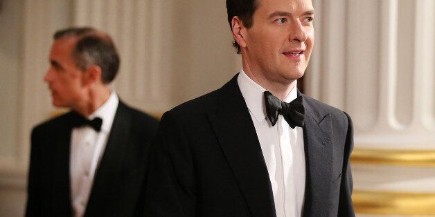 Chancellor of the Exchequer George Osborne is followed by Mark Carney, Governor of the Bank of England, as they enter the Lord Mayor's Dinner to the Bankers and Merchants of the City of London at Mansion House, central London.