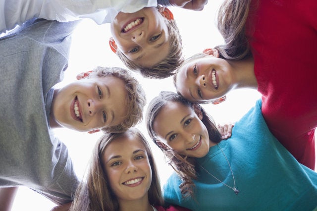 Low angle view of friends in a huddle