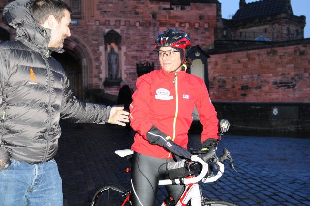 EDINBURGH, UNITED KINGDOM - FEBRUARY 08: Davina McCall says goodbye to her husband Matthew as she sets off on her BT Sport Relief Challenge in which she will attempt to cycle, swim and run 500 miles from Edinburgh to London in 7 days at Edinburgh Castle on February 8, 2014 in Edinburgh, Scotland. (Photo by Martin Fraser/Getty Images)