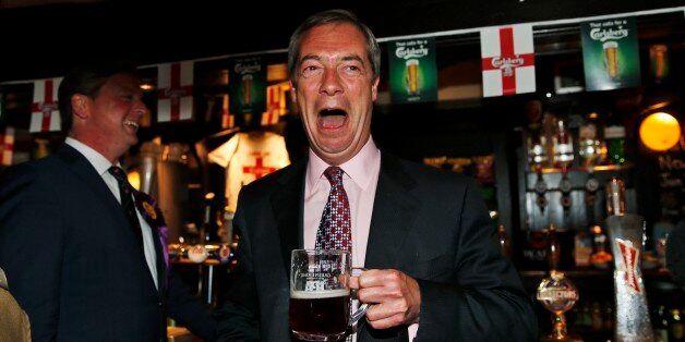 Nigel Farage, leader of Britain's United Kingdom Independence Party (UKIP) enjoys a pint of beer at a pub in South Benfleet, England, Friday, May 23, 2014. UKIP, Britain's anti-European party has made big gains in local elections, taking votes from both the governing Conservatives and main opposition Labour Party. It's a strong performance for the U.K. Independence Party, which advocates pulling Britain out of the EU and stopping the unfettered right to entry of European citizens. With about a third of results declared Friday from voting for 161 local authorities, UKIP had almost 100 seats, well over its predicted total of 80. Britons also voted Thursday in European Parliament elections. Those results will be announced Sunday along with tallies from 27 other EU countries. (AP Photo/Lefteris Pitarakis)
