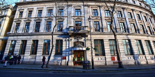 LONDON, ENGLAND - DECEMBER 24: Squatters from a group calling themselves 'Love Activists' sit on the balcony of a previously unoccupied building on December 24, 2014 in London, England. Previously leased by the Royal Bank of Scotland group, the squatters plan to open the building on Christmas Day and provide a free lunch for homeless people in a protest against the housing crisis. (Photo by Carl Court/Getty Images)