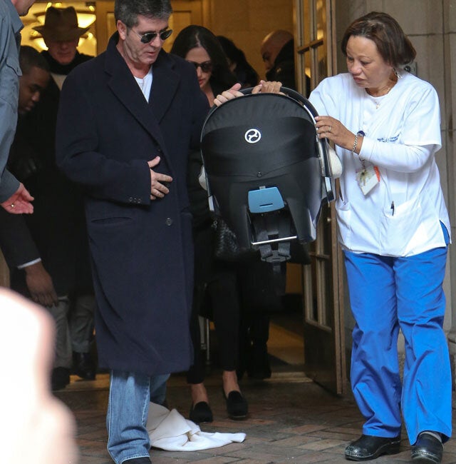 'HandsOn' Dad Simon Cowell Carries Baby Eric Out Of Hospital