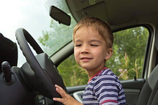 Boy driving a car