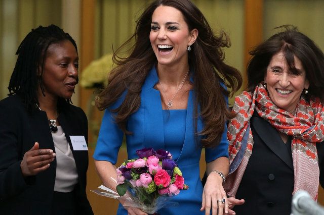 EALING, ENGLAND - FEBRUARY 14: Catherine, Duchess of Cambridge jokes with staff as she leaves the opening of the ICAP Art Room at Northolt High School on February 14, 2014 in Ealing, England. (Photo by Danny Martindale/WireImage)