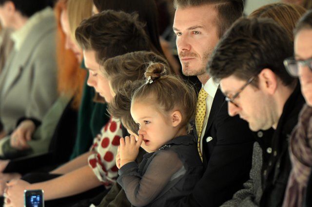 Harper Beckham picks her nose on dad David Beckham's lap