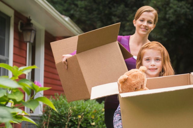 Mother and daughter with moving boxes