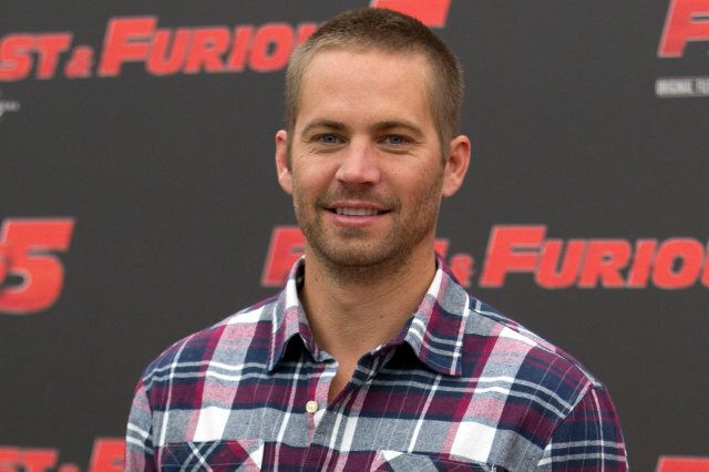 FILE - In this April 29, 2011 file photo, actor Paul Walker poses during the photo call of the movie