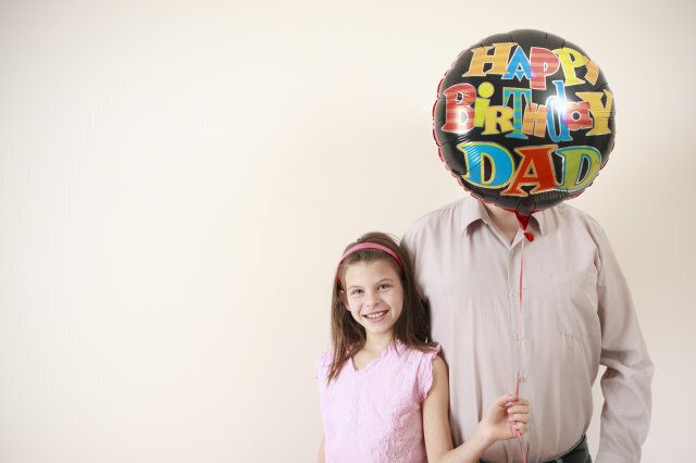 father and daughter posing for birthday photo