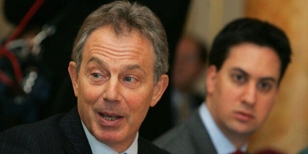 Britain's Prime Minister Tony Blair gestures as he talks during a Policy Review meeting as Cabinet Parliamentary Secretary Ed Miliband, right looks on, inside 10 Downing Street London, Monday Jan. 15, 2007. (AP Photo/Alastair Grant, WPA POOL)