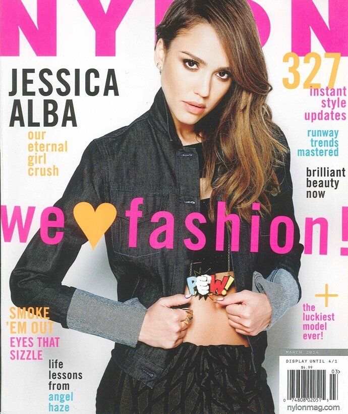 Pow! Jessica alba shows off her midriff for the cover of Nylon magazine. The actress wore a denim jacket and a 'POW!' necklace hanging just above her clenched hands, with her nails painted different colours on each hand. Inside she told the mag that for her acting