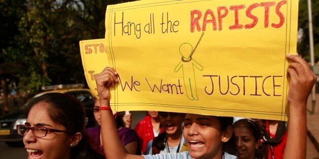 Indian students hold placards and shout slogans during a protest organized to create awareness on gender- based violence on women in Mumbai, India, Wednesday, Dec 10, 2014. The alleged rape by a driver of a taxi-booking service Uber in New Delhi last week, almost two years after a young woman was fatally gang raped on a bus in the capital, has renewed national anger over sexual violence in India and demands for more effort to ensure women's safety. (AP Photo/Rafiq Maqbool)