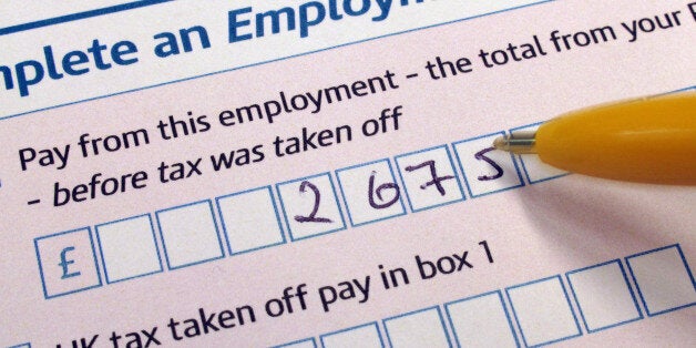 File photo dated 22/06/10 of a person completing a self assessment tax return form as callers to key government tax and benefit helplines are waiting twice as long to get through as last year, latest official records show.