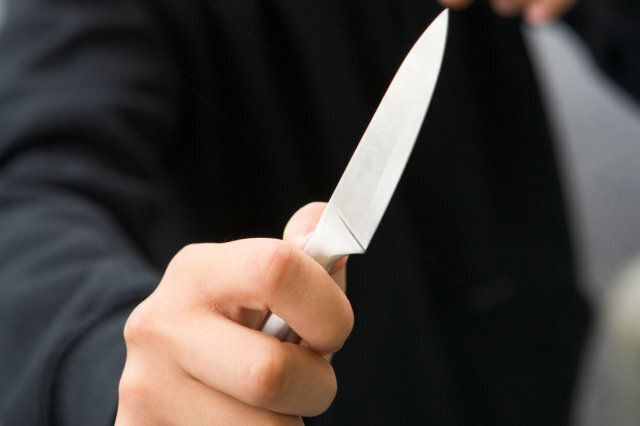 Teenage Boy Brandishing Knife