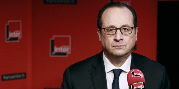 French President Francois Hollande prepares to answer journalists' questions during a live interview on French radio station France Inter on January 5, 2015 in Paris