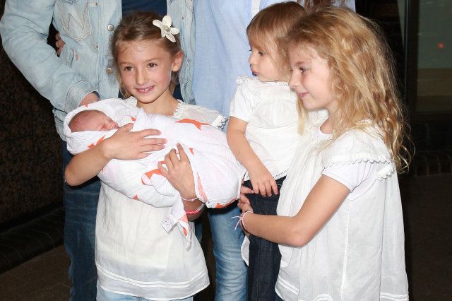 Jamie Oliver and wife Jools Oliver, with daughters poppy Honey, Daisy Boo and Blossom Rainbow, leave Portland Hospital with their newborn baby son Buddy on September 16, 2010 in London, England.