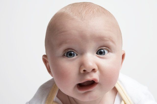 Baby boy (3-6 months) looking at camera, portrait