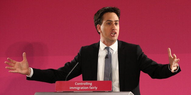 GREAT YARMOUTH, ENGLAND - DECEMBER 15: Labour party leader Ed Miliband gestures during a speech on December 15, 2014 in Great Yarmouth, England. Miliband set out plans to stop cheap foreign workers replacing British staff, stating that a Labour government would pass a law to criminalise such behaviour. (Photo by Carl Court/Getty Images)