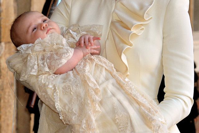 LONDON, ENGLAND - OCTOBER 23: (EDITORS NOTE: Retransmission with alternate crop.) Catherine, Duchess of Cambridge carries her son Prince George Of Cambridge after his christening at the Chapel Royal in St James's Palace on October 23, 2013 in London, England. (Photo by John Stillwell - WPA Pool /Getty Images)