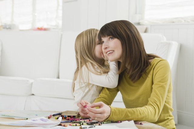 Daughter whispering to mother