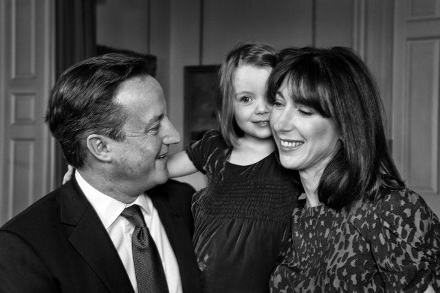 LONDON, UNITED KINGDOM - OCTOBER 16: (ONE TIME FREE USAGE IN UK PRESS BEFORE DECEMBER 25, 2013, ALL SUBSEQUENT USAGES, AND USAGES AFTER STIPULATED DATE, WILL BE BILLED BY GETTY IMAGES) (NO ONE TIME FREE USAGE OUTSIDE UK) (EXCLUSIVE COVERAGE) British Prime Minister David Cameron and his wife Samantha photographed with daughter Florence at 10 Downing Street for their 2013 Christmas card, on October 16, 2013 in London, England. (Photo by Tom Stoddart/Getty Images)