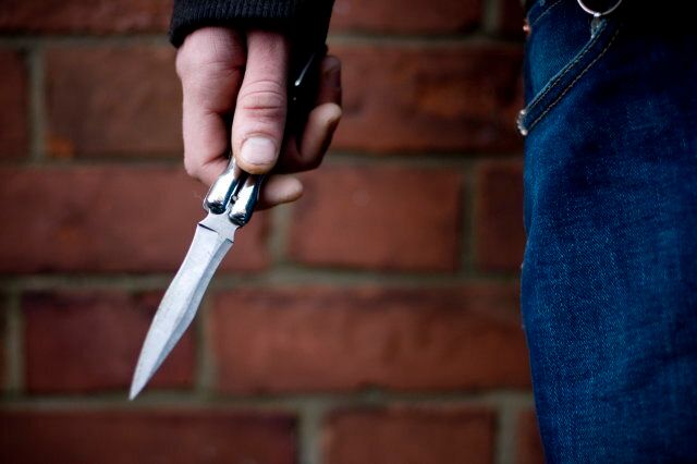 A youth brandishing a knife