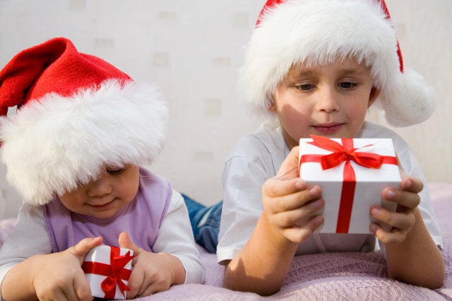 two small children lie on a...