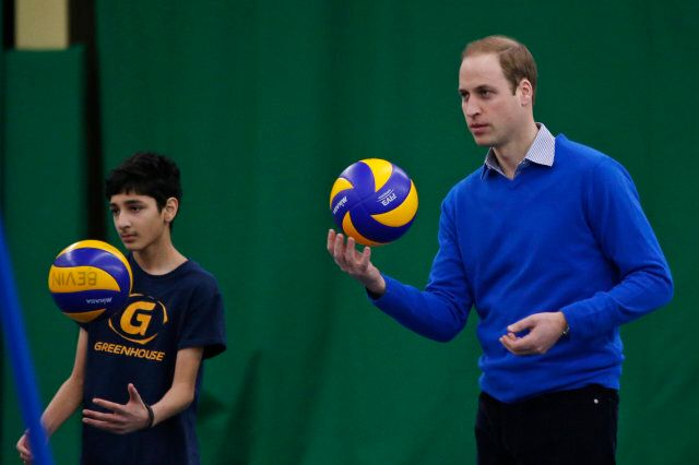 Britain's Prince William, the Duke of Cambridge, plays volleyball with children during a Coach Core apprentice training program session at Westway Sports Centre, in London, Wednesday, Dec. 4, 2013. (AP Photo/Lefteris Pitarakis)