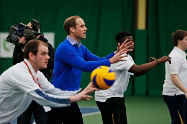 Britain's Prince William, the Duke of Cambridge, plays volleyball with children during a Coach Core apprentice training program session at Westway Sports Centre, in London, Wednesday, Dec. 4, 2013. (AP Photo/Lefteris Pitarakis)