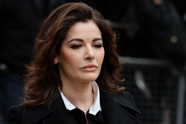 British television chef Nigella Lawson arrives at Isleworth Crown Court in west London, on December 4, 2013, as she prepares to give evidence in a case in which her two personal assistants (Elisabetta and Francesca Grillo) are accused of defrauding her and former husband Charles Saatchi. AFP PHOTO/BEN STANSALL (Photo credit should read BEN STANSALL/AFP/Getty Images)